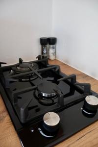 a stove top oven sitting on top of a counter at De Schelde Beach Cottage in Wilderness