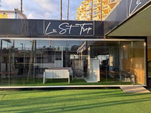 a store front with a bench in the window at costa blanca marbella in Marbella