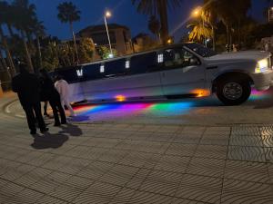 a limo with people standing in front of it at costa blanca marbella in Marbella
