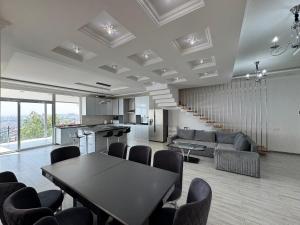 a large living room with a table and chairs at Villa in Norq -Marash in Yerevan