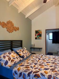 a bedroom with two beds and a flat screen tv at Casa MIA in Cabarete +30 photos