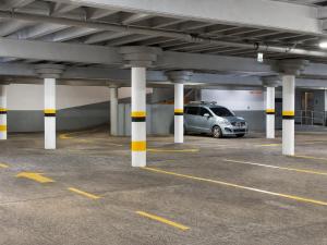 a parking garage with a car parked in it at Hotel Castilla in David