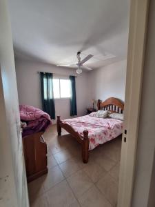 a bedroom with a bed and a window at Complejo la Superiora in Villa Krause