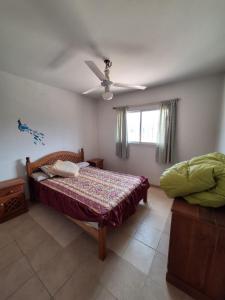 a bedroom with a bed and a ceiling fan at Complejo la Superiora in Villa Krause
