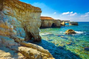 a view of the ocean with rocks in the water at Peyia traditional house in Paphos