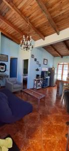 a living room with a couch and a table at CHIK Coatepec Comfort in Coatepec
