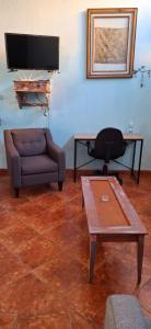 a living room with a couch and a table at CHIK Coatepec Comfort in Coatepec