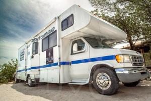 an rv is parked in a parking lot at MUUN experience in Ciudad del Carmen +136 photos