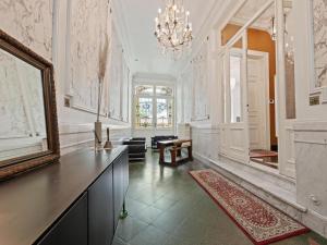 a large room with a mirror and a table at La Maison Bleue petite in Ronse +33 photos