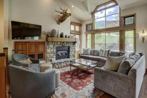 a living room with two couches and a fireplace at Beaver Creek Village by Vail Resorts in Avon