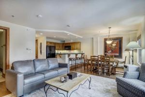 a living room with a couch and a table at Beaver Creek Village by Vail Resorts in Avon