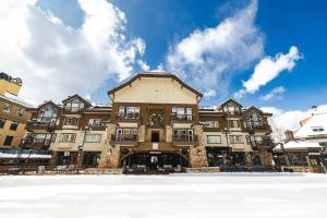 a large building with snow in front of it at Beaver Creek Village by Vail Resorts in Avon