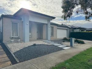 a house with a driveway in front of it at Cozy and comfortable room - Geelong suburbs in Grovedale