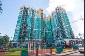 a large building with a playground in front of it at Apartment Versailles Park 1 in Irpin