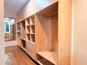 a walk in closet with wooden shelves in a room at 2BR Oceanview Villas - Slice of Paradise, Central Suva in Suva