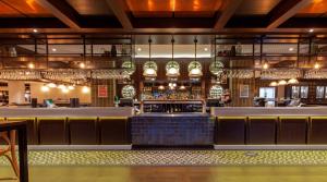a bar in a restaurant with a bar counter at Harrigan's Hunter Valley in Pokolbin