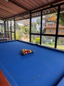 a pool table with balls on top of it at Hotel posada el paraíso in Tepoztlán