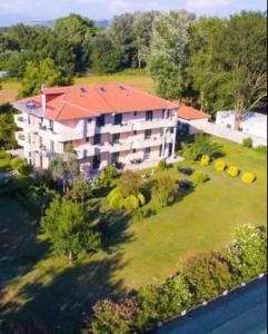 an aerial view of a building with a yard at Adriatic Garden Rooms in Bregvija