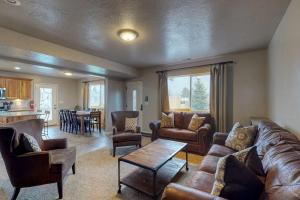 a living room with a couch and a table at Sunset Vista in Garden City