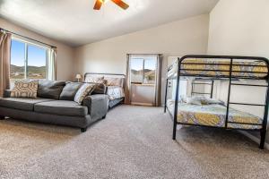 a living room with two bunk beds and a couch at Sunset Vista in Garden City