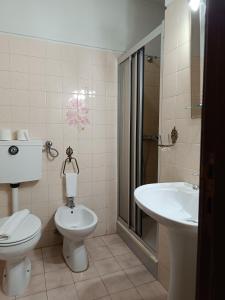 a bathroom with a toilet and a sink at São Neutel in Chaves +81 photos
