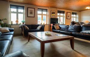 a living room with couches and a coffee table at 4 Bedroom Gorgeous Home In Stege in Stege