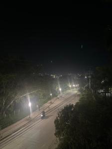 an empty city street at night with street lights at Hotel Provenza Suites in Ocaña