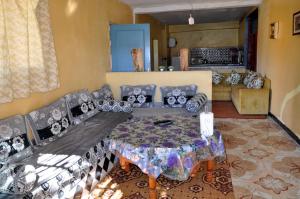 a living room with a couch and a table at Magic View in Bine el Ouidane +43 photos