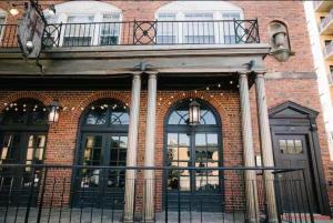 a brick building with a balcony on top of it at The Wilson in Madison +11 photos