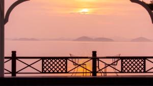 a view of the ocean from a balcony at sunset at Taean Supsogui Bada Pension in Panggal-li