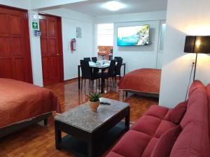 a living room with a couch and a dining room at Gran Tonantzin in San Martín de las Pirámides