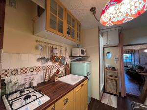 a kitchen with a sink and a stove top oven at 十度-jude- in Osaka