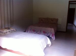 A bed or beds in a room at Farm Muquem