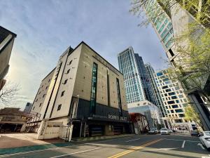 a building on a city street with tall buildings at Daegu Romeo and Juliet in Daegu