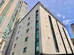 a building in a city with tall buildings at Daegu Romeo and Juliet in Daegu