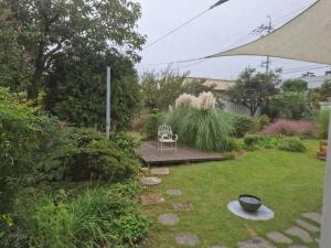 a garden with a chair and a table in the grass at Jangheung Stay 1978 in Jangheung