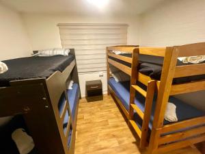 a room with two bunk beds in a room at Casas Rabad in Punta Arenas