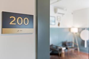 a sign on a door in a room at Hotel Scandi Poulsbo in Poulsbo