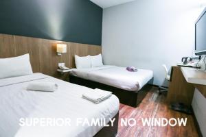 a hotel room with two beds and no window at Hotel 99 Botanik Klang in Klang +25 photos