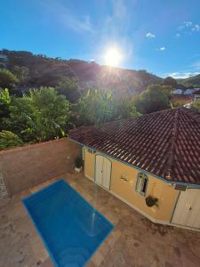 a view of a house with a blue yoga mat at Pousada das Flores in Conservatória +45 photos