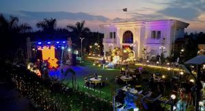 an event in front of a white building at night at The White Lilly in Noida +17 photos