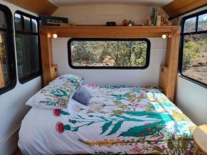 a bed in the back of a camper van at Lava Bus in Hawaiian Ocean View