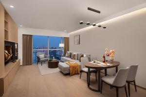 a living room with a couch and a table at Ascott Guangzhou in Guangzhou