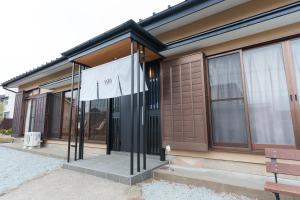 a house with a flag in front of it at WTN Way too nice in Fujikawaguchiko
