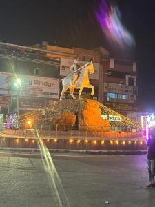 a statue of a horse on top of a building at Hotel park view in Bathinda