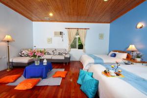 Katil atau katil-katil dalam bilik di Zhen Shan Zhuang B&B