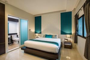 Postel nebo postele na pokoji v ubytování The Nice Krabi Hotel