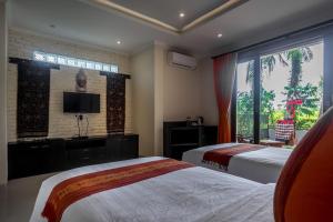 Letto o letti in una camera di Gefecon Villa Ubud