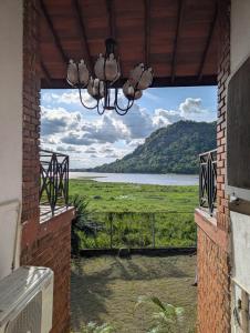 a view from a porch with a view of a lake at Hotel Villa Lake View in Kurunegala