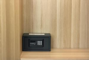 a small microwave sitting on top of a shelf at Veniero37 Guest House in Rome